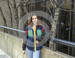 Hip sixteen year old girl standing on sidewalk in Center City Philadelphia