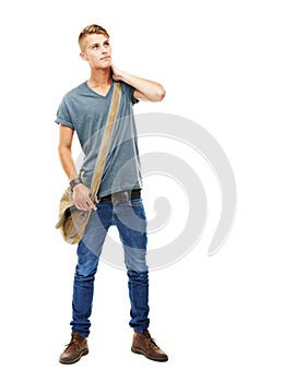 Hip urban fashion. A full length studio portrait of a stylish young man carrying a messengers bag isolated on white.