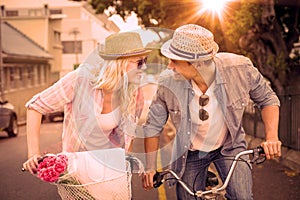 Hip young couple going for a bike ride