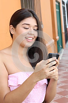 Hip young woman using the new technologies