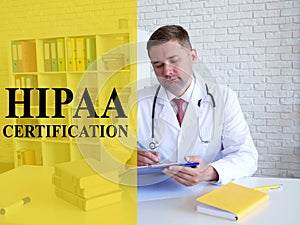 HIPAA certification concept. The doctor fills out documents.