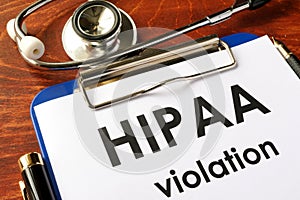 HIPAA violation form on a clipboard.