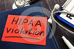 Hipaa violation inscription on a piece of paper