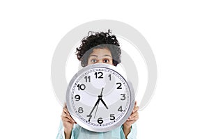 Hipanic woman holding big clock on her face