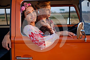 Hippie couple in a van on a road trip