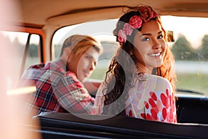 Hippie couple in a van on a road trip