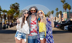 Hippie friends showing peace at venice beach in la