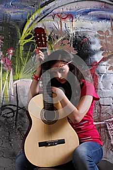 Hippie girl with guitar