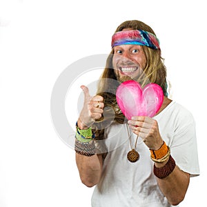 Hippie holding a love heart gestering thumbs up