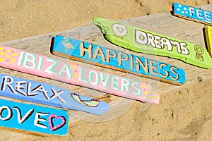 Hippie market with signs and accessory on the beach..