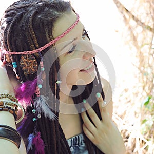 Hippie style young woman with dreadlocks portrait, outdoor