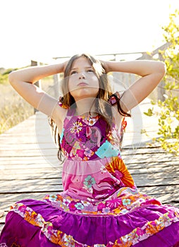 Hippy purple dress teen girl relaxed outdoors photo