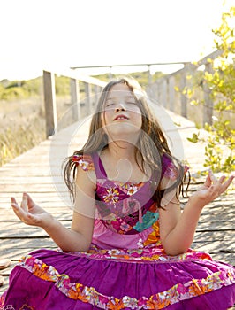 Hippy purple dress teen girl relaxed outdoors photo