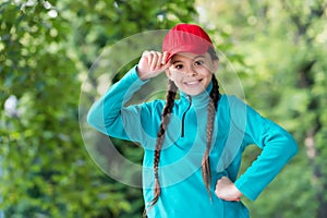 Hipster baby. Happy hipster wear snapback natural outdoors. Little child smile in hipster style. Hip hop girl. Funky