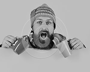 Hipster with beard and shocked face has fragrant coffee