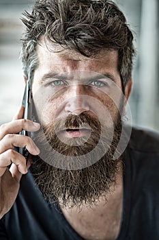 Hipster bearded communicate smartphone call. Mobile communication. Communication concept. Man with beard and mustache