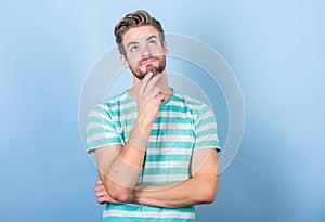 Hipster bearded face not sure in something. Thoughtful man on blue background. Thoughtful expression. Need to think