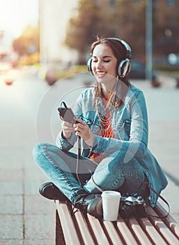 Hipster beautiful girl listening music