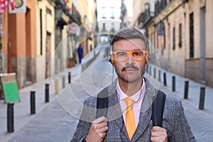 Hipster businessman listening to music