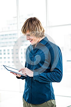 Hipster businessman using tablet