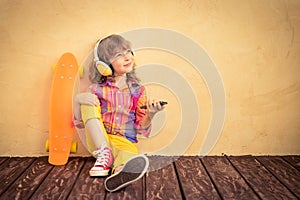 Hipster child with skateboard