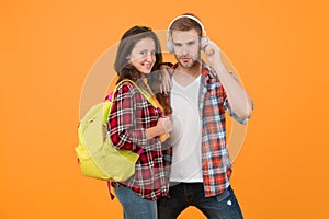 hipster couple ready for learning. ebook and audio book concept. study together is fun. back to school. Happy students