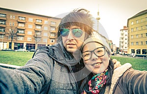 Hipster couple of tourists taking a selfie in Berlin City