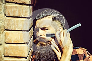 Hipster cutting with razor