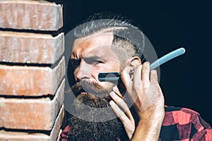 Hipster cutting with razor