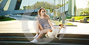 Hipster Fashion Girl with her Dog in the City