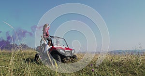 Hipster friends having fun with color flares and while driving off road car in nature. Adventurous spirit and freedom