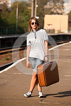 Hipster girl at railways platform.