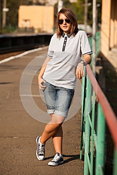 Hipster girl at railways platform.