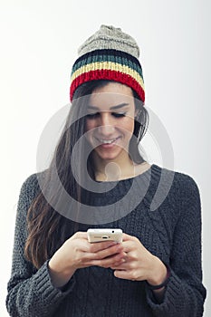 Hipster girl reading good news on the phone
