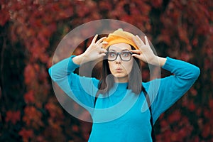 Funny Woman with Eyeglasses and Pumpkin Beret Enjoying Autumn