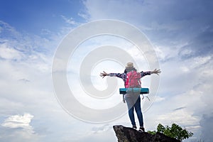 Hipster girl traveler shows independent gesture and are enjoying photo