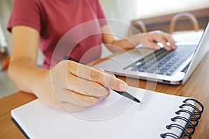 Hipster Girl use Laptop. Copped of female freelancer working mobile in cafe.