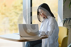 Hipster Girl use Laptop huge Loft Studio.Student Researching Process Work.Young Business Woman Working Creative Startup