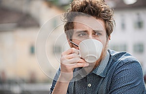 Hipster guy drinking a coffee