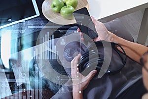 hipster hand using smart phone for mobile payments online business,headphone,sitting on sofa in living room,green apples in photo