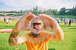 Hipster happy celebrate event picnic fest or festival. Cheerful fan love summer fest. Man bearded hipster in front of