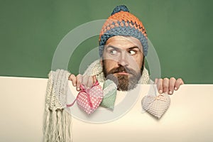 Hipster with heart on green white background.