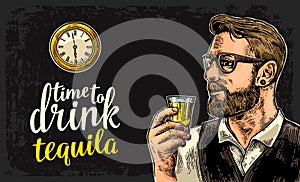 Hipster holding a glass of rum and antique pocket watch.