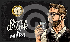 Hipster holding a glass of vodka and antique pocket watch.
