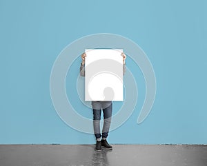 Hipster holding poster