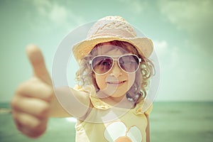 Hipster kid at the beach