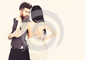 Hipster with lady dressed up, copy space. Elegant couple concept. Couple in love, bride and groom in elegant clothes