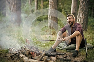 Hipster man with beard happy smile and roast sausages