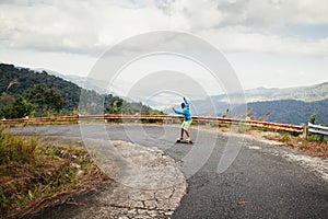 Hipster man longboarding extremely in tropcis