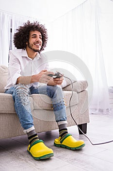 Hipster man playing computer games